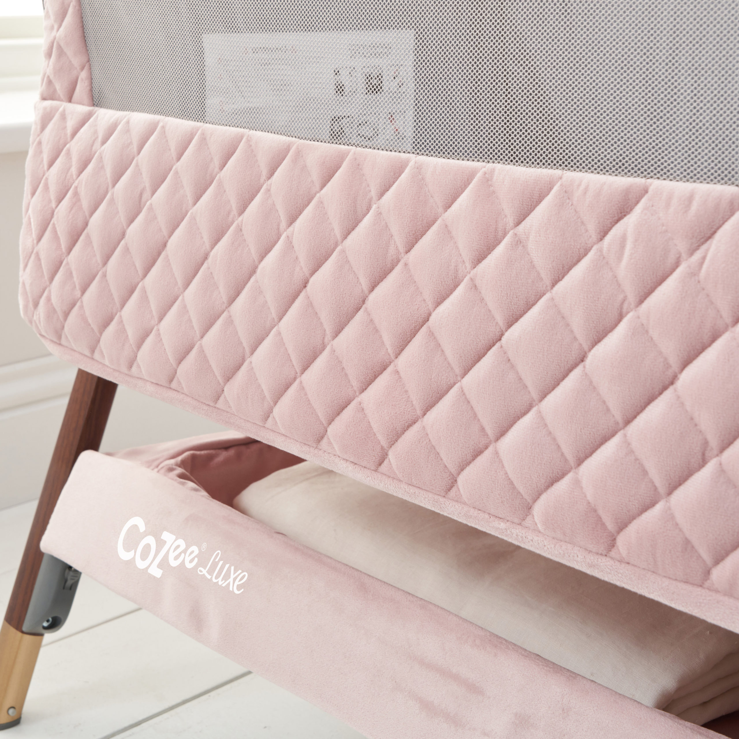 CoZee Luxe Bedside Crib Walnut Blush Detail CoZee Luxe Bedside Crib Walnut Blush Detail